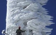 A telecommunications tower after a snowstorm