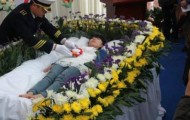 Chinese woman rehearsing his own funeral