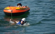 8 year old boy crossed the finish line of triathlon with his paralyzed brother