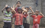Indian boy with giant hands that are larger than its own head