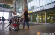 A man dressed in knight armor given made ​​a stewardess
